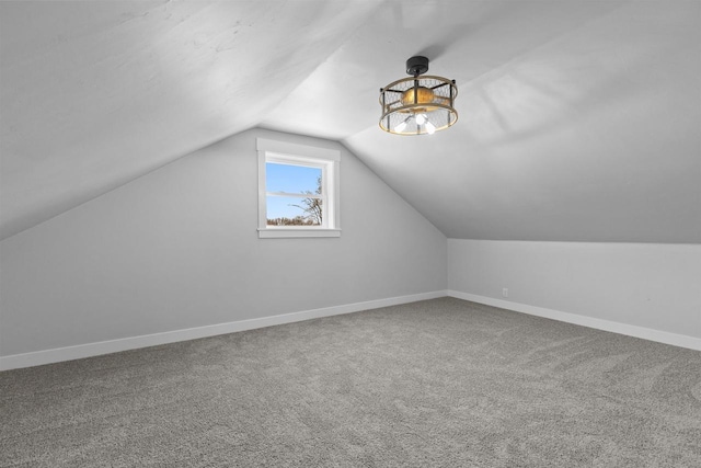 N5599 Mill St, Shiocton, WI 54170 - additional living space with vaulted ceiling, carpet floors, and baseboards
