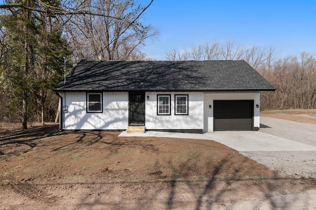 N5599 Mill St, Shiocton, WI 54170 - view of front of home with a shingled roof, driveway, entry steps, and a garage