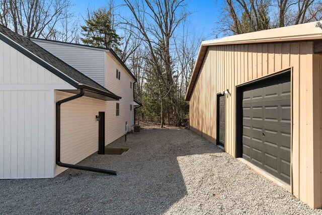 N5599 Mill St, Shiocton, WI 54170 - view of property exterior with central AC and a garage
