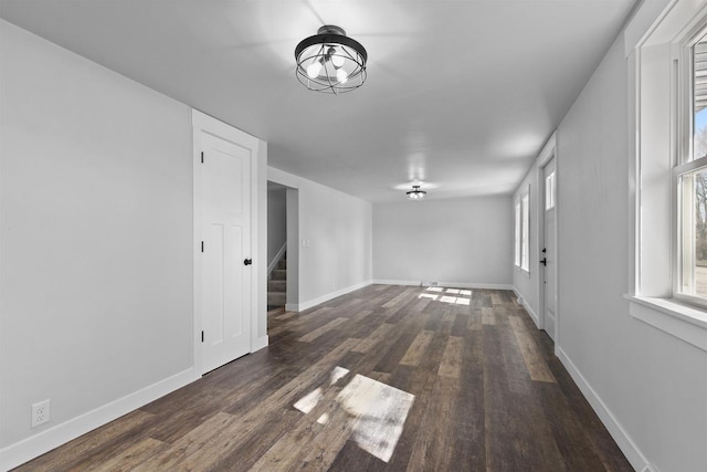 N5599 Mill St, Shiocton, WI 54170 - spare room featuring baseboards, wood finished floors, and stairs