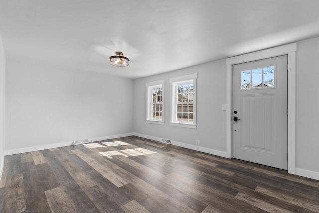 N5599 Mill St, Shiocton, WI 54170 - entrance foyer with dark wood finished floors, visible vents, and baseboards