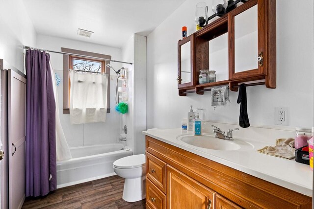 N2226 State Road 57, New Holstein, WI 53061 - bathroom featuring vanity, shower / tub combo, wood finished floors, and toilet