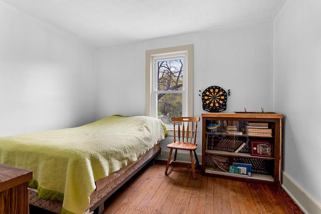 N2226 State Road 57, New Holstein, WI 53061 - bedroom featuring wood-type flooring and baseboards
