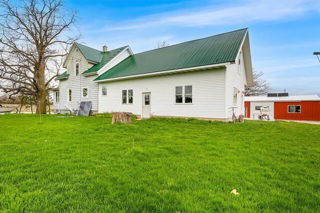 N2226 State Road 57, New Holstein, WI 53061 - rear view of house with a yard, a chimney, and metal roof