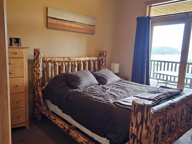 carpeted bedroom with access to exterior