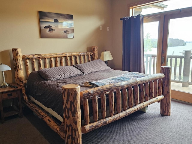 carpeted bedroom with access to outside