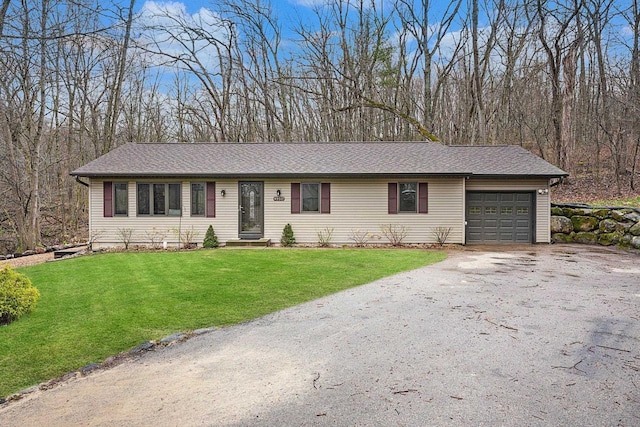 W9517 Parkway Dr, Poynette, WI 53955 - single story home with driveway, a front yard, and an attached garage