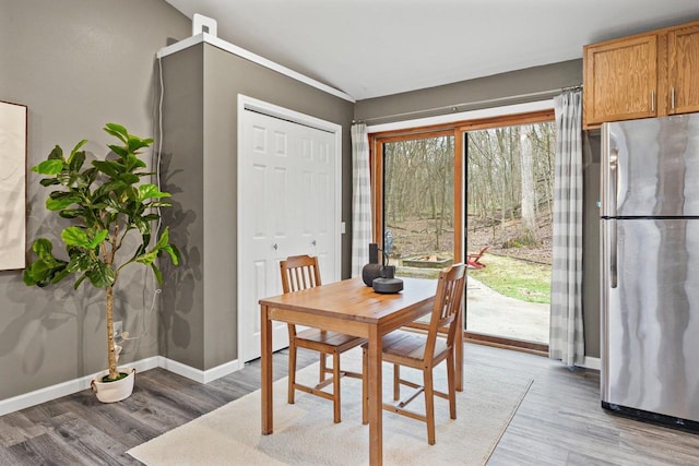 W9517 Parkway Dr, Poynette, WI 53955 - dining space with light wood-type flooring and baseboards