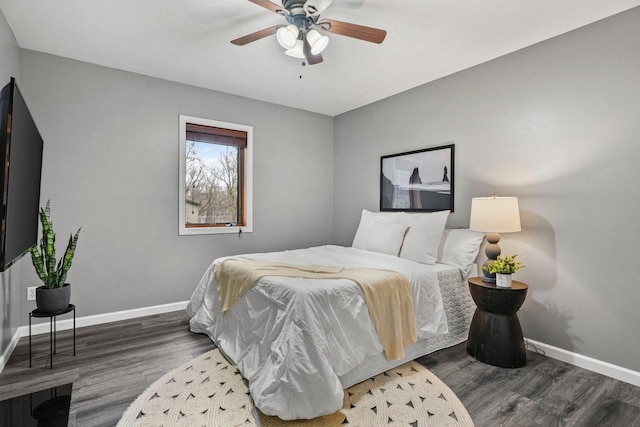 W9517 Parkway Dr, Poynette, WI 53955 - bedroom featuring baseboards, wood finished floors, and a ceiling fan