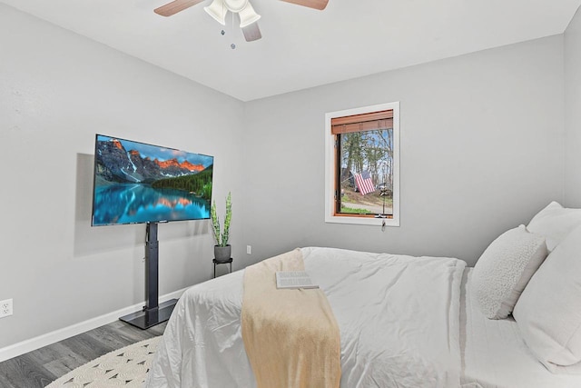 W9517 Parkway Dr, Poynette, WI 53955 - bedroom with wood finished floors, ceiling fan, and baseboards