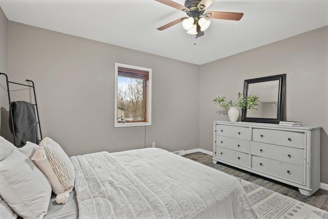 W9517 Parkway Dr, Poynette, WI 53955 - bedroom featuring baseboards, wood finished floors, and ceiling fan