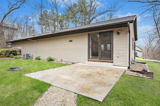 W9517 Parkway Dr, Poynette, WI 53955 - back of property featuring a patio, central air condition unit, and a yard
