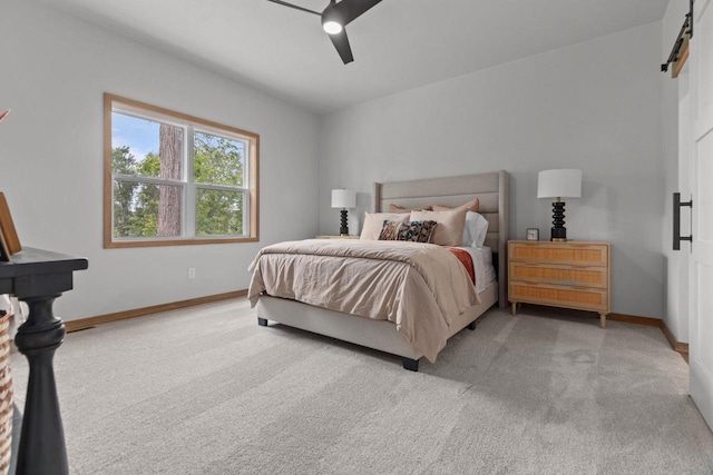 3216 Eclipse Dr, Green Bay, WI 54311 - carpeted bedroom with a barn door and ceiling fan