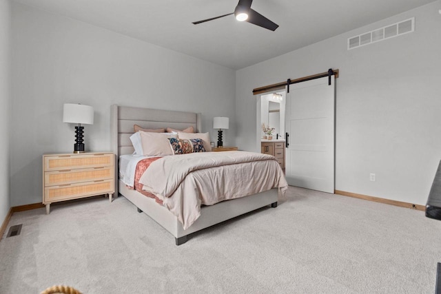 3216 Eclipse Dr, Green Bay, WI 54311 - bedroom featuring a barn door, carpet, ceiling fan, and ensuite bath
