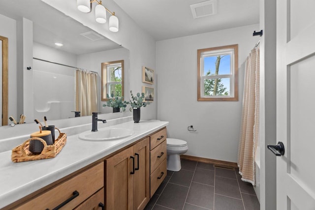 3216 Eclipse Dr, Green Bay, WI 54311 - bathroom with vanity, plenty of natural light, tile patterned flooring, and shower / tub combo