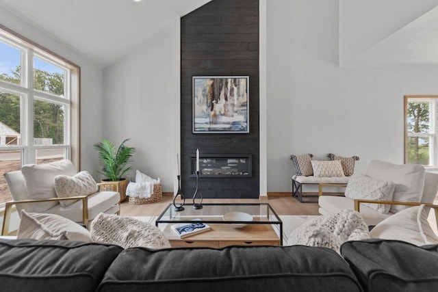 3216 Eclipse Dr, Green Bay, WI 54311 - living room with a fireplace, lofted ceiling, and wood finished floors