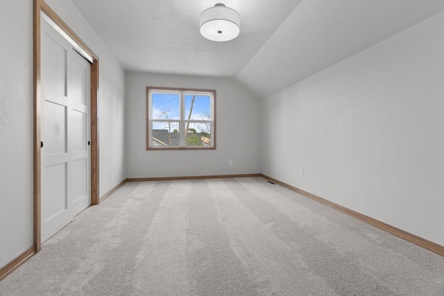3216 Eclipse Dr, Green Bay, WI 54311 - unfurnished bedroom featuring light colored carpet and vaulted ceiling