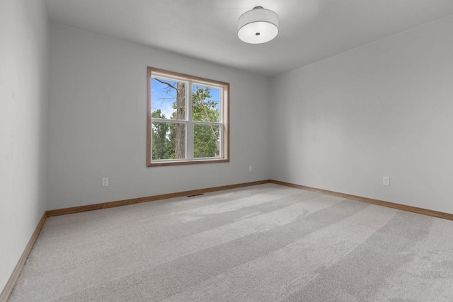 3216 Eclipse Dr, Green Bay, WI 54311 - spare room featuring light colored carpet and baseboards