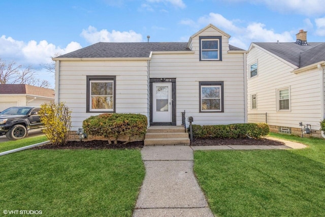 4858 N 73rd St, Milwaukee, WI 53218 - view of front facade with roof with shingles and a front yard