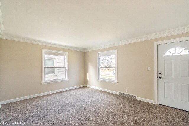 4858 N 73rd St, Milwaukee, WI 53218 - carpeted foyer entrance featuring baseboards, crown molding, and visible vents