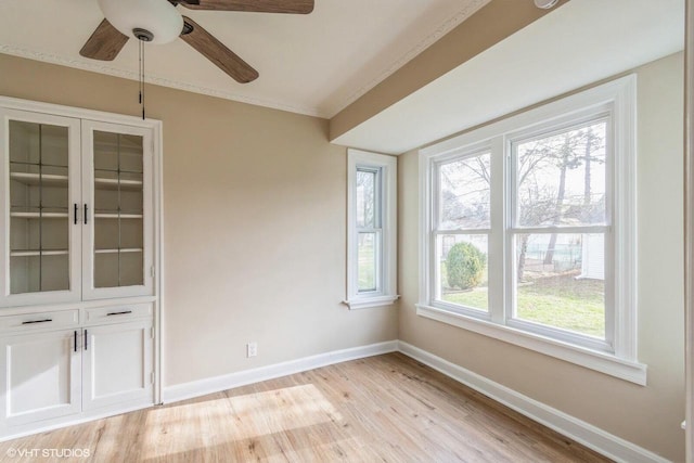 4858 N 73rd St, Milwaukee, WI 53218 - spare room with light wood finished floors, ornamental molding, baseboards, and ceiling fan