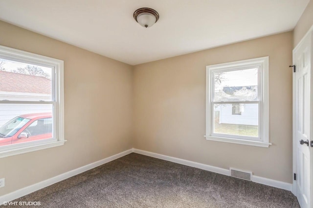 4858 N 73rd St, Milwaukee, WI 53218 - empty room with dark colored carpet, visible vents, and baseboards