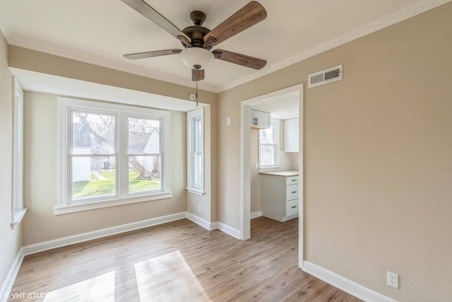 4858 N 73rd St, Milwaukee, WI 53218 - unfurnished bedroom with light wood-type flooring, baseboards, visible vents, and multiple windows