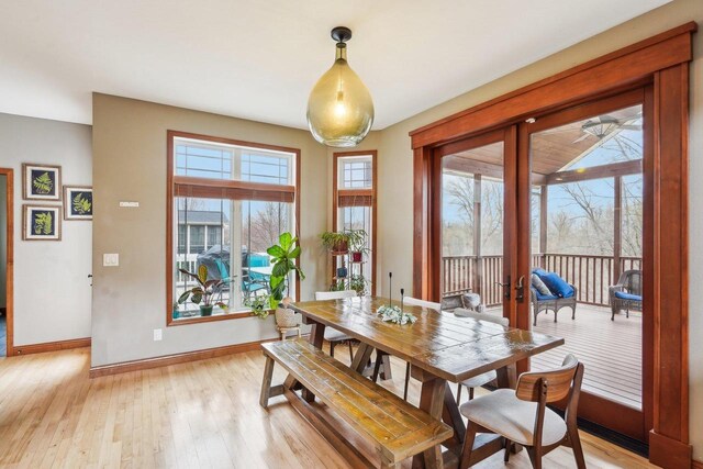 1310 Hanover Ct, Waunakee, WI 53597 - dining room with light wood-style floors, baseboards, and french doors