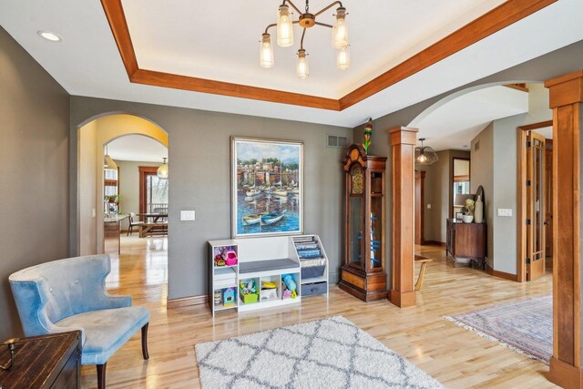 1310 Hanover Ct, Waunakee, WI 53597 - recreation room featuring light wood finished floors, baseboards, and arched walkways