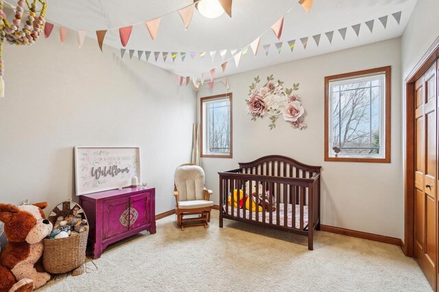 1310 Hanover Ct, Waunakee, WI 53597 - carpeted bedroom featuring baseboards and a closet