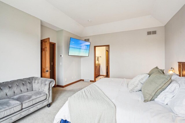 1310 Hanover Ct, Waunakee, WI 53597 - bedroom featuring baseboards, visible vents, light colored carpet, and connected bathroom