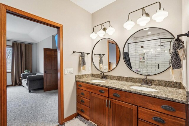 1310 Hanover Ct, Waunakee, WI 53597 - full bath with a sink, double vanity, and a stall shower
