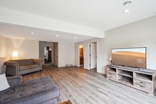 1310 Hanover Ct, Waunakee, WI 53597 - living room featuring baseboards, wood finished floors, visible vents, and recessed lighting