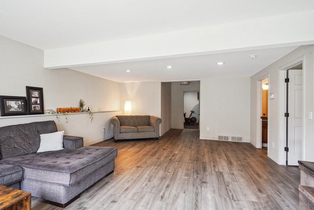 1310 Hanover Ct, Waunakee, WI 53597 - living area with visible vents, baseboards, wood finished floors, and recessed lighting
