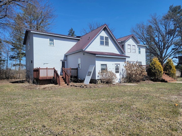 N14341 Fairground Ave, Owen, WI 54460 - back of house featuring metal roof, a yard, and a deck