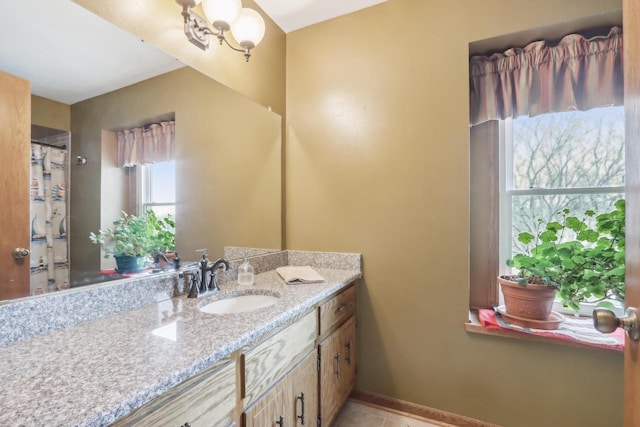 full bath with vanity and tile patterned flooring