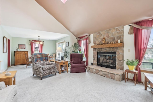carpeted living room featuring a wealth of natural light, a fireplace, and high vaulted ceiling