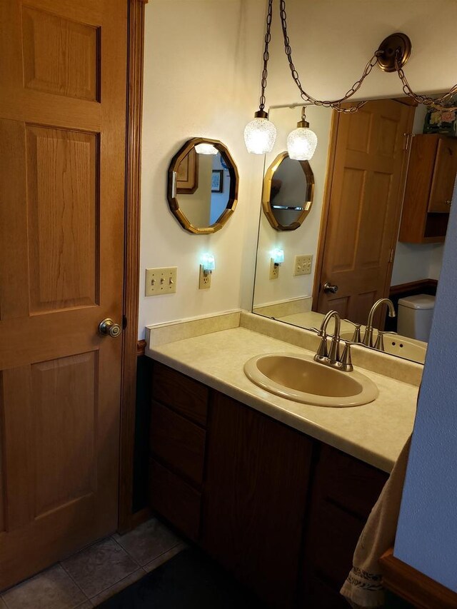 3821 90th St N, Wisconsin Rapids, WI 54494 - bathroom featuring tile patterned floors, vanity, and toilet