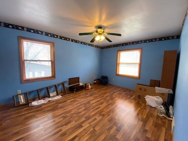 interior space featuring ceiling fan and wood finished floors