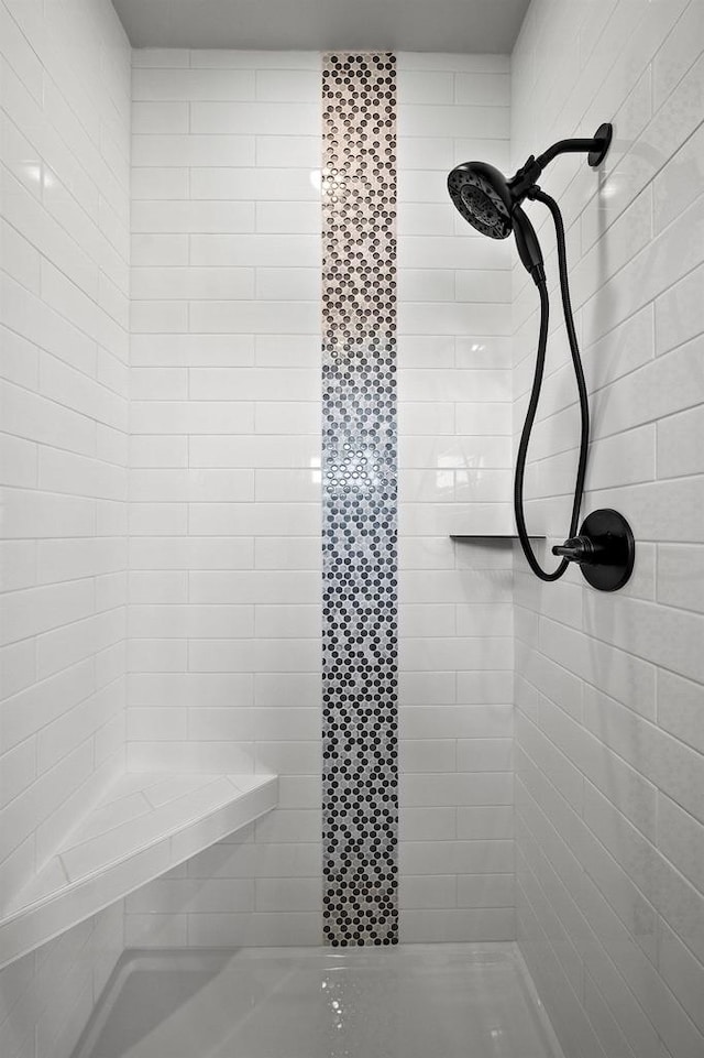 bathroom with tiled shower