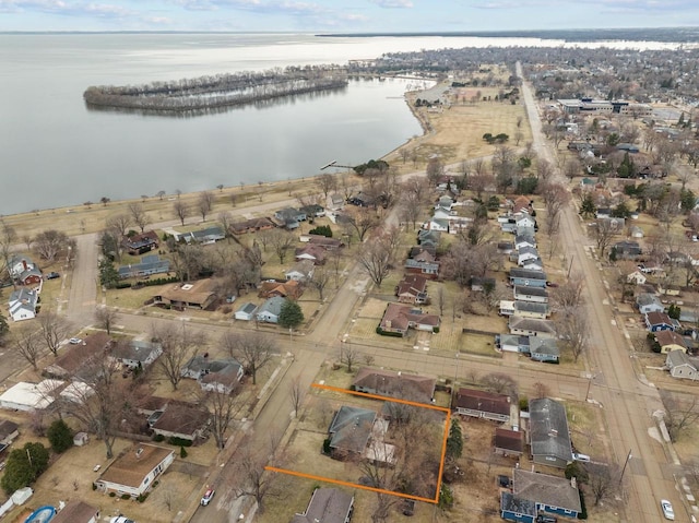 bird's eye view featuring a residential view and a water view
