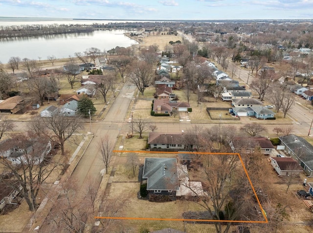 bird's eye view featuring a water view and a residential view