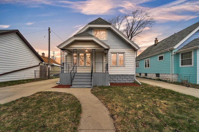 6824 W Hayes Ave, West Allis, WI 53219 - bungalow-style home featuring a yard and covered porch