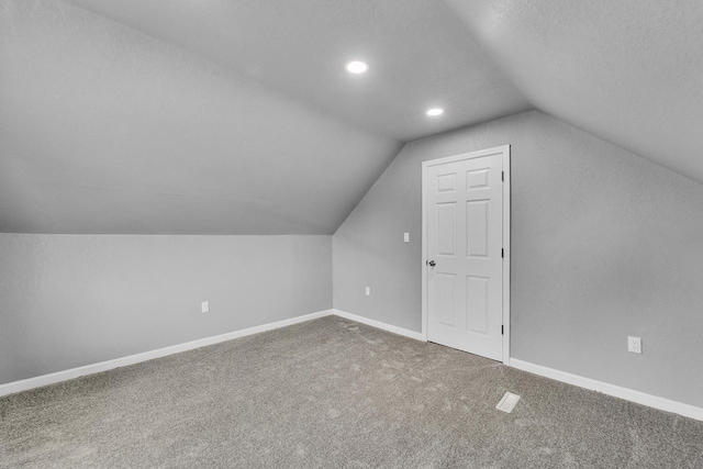 6824 W Hayes Ave, West Allis, WI 53219 - additional living space with recessed lighting, lofted ceiling, baseboards, and carpet