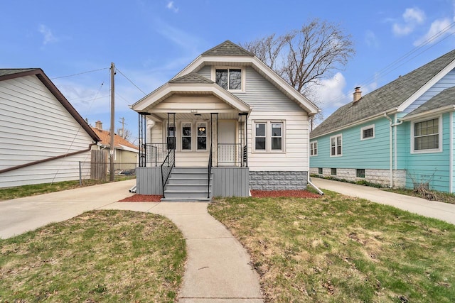 6824 W Hayes Ave, West Allis, WI 53219 - bungalow featuring a front lawn and covered porch