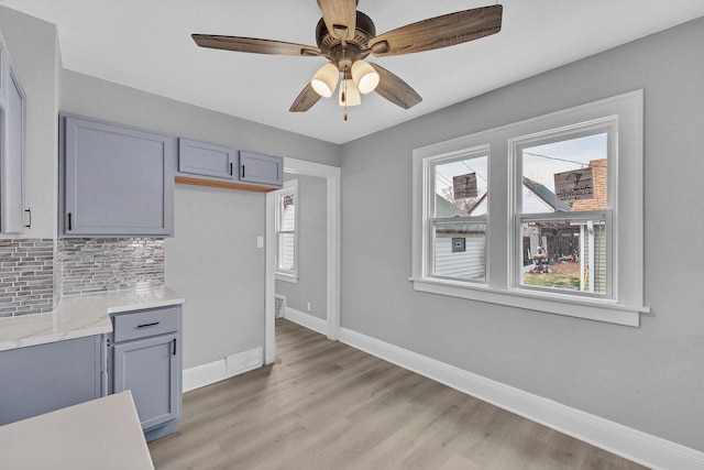 6824 W Hayes Ave, West Allis, WI 53219 - kitchen with plenty of natural light, baseboards, and gray cabinets