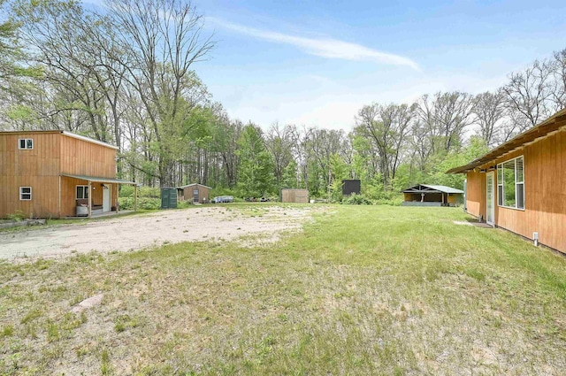 W13670 Brooks Ln, Crivitz, WI 54114 - view of yard with an outdoor structure and a storage unit