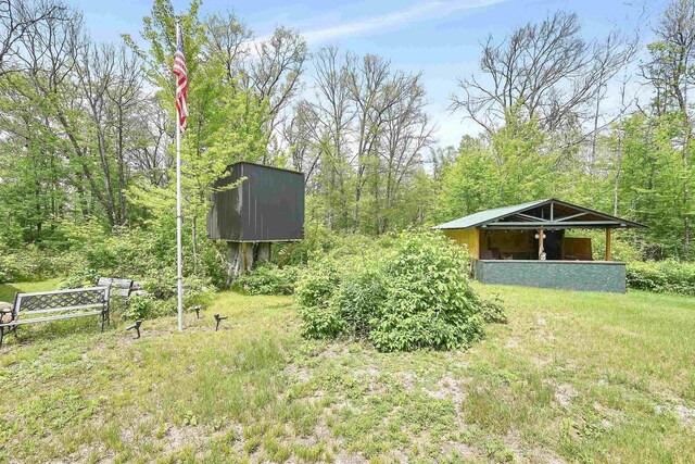W13670 Brooks Ln, Crivitz, WI 54114 - view of yard with an outdoor structure