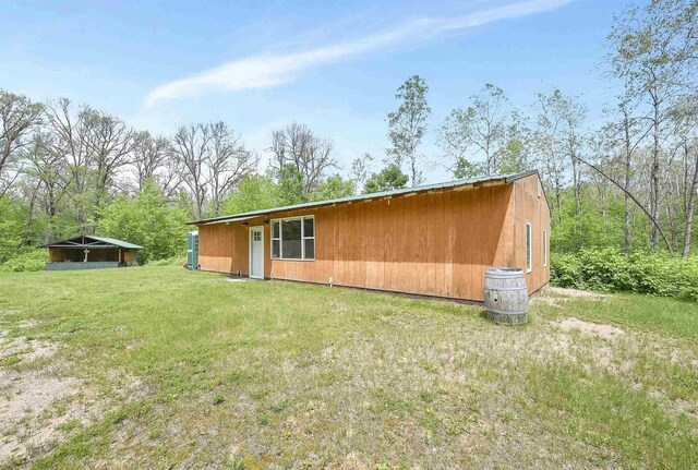 W13670 Brooks Ln, Crivitz, WI 54114 - rear view of house with a yard