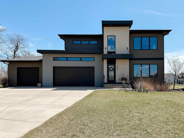 808 Winery Way, Cambridge, WI 53523 - view of front of property with concrete driveway, a front lawn, board and batten siding, and an attached garage